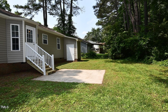 5949 Sandy Run, Knightdale, NC 27545 - view of green lawn with a patio
