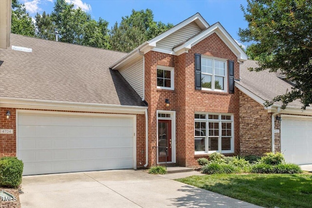 4724 Ludwell Branch Ct, Raleigh, NC 27612 - traditional-style home with an attached garage, driveway, roof with shingles, and brick siding