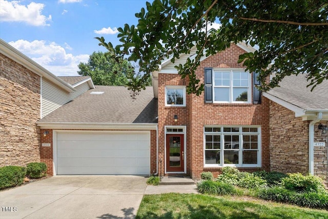 4724 Ludwell Branch Ct, Raleigh, NC 27612 - traditional home with an attached garage, driveway, brick siding, and roof with shingles