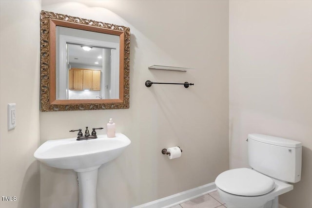 4724 Ludwell Branch Ct, Raleigh, NC 27612 - half bathroom with toilet, tile patterned floors, and baseboards