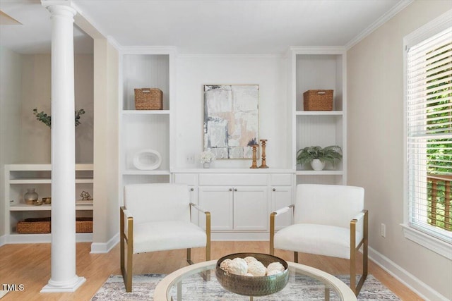 4724 Ludwell Branch Ct, Raleigh, NC 27612 - sitting room with light wood-style floors, built in features, ornamental molding, decorative columns, and baseboards
