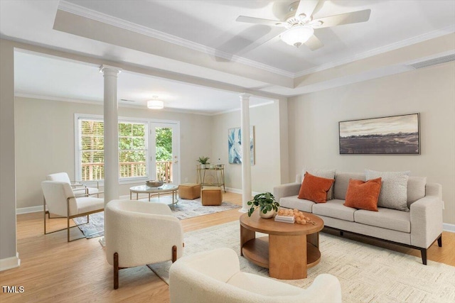 4724 Ludwell Branch Ct, Raleigh, NC 27612 - living room featuring ornate columns, light wood-style flooring, baseboards, crown molding, and ceiling fan