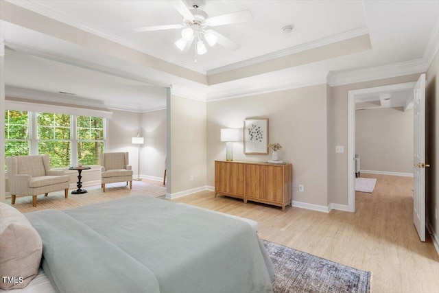 4724 Ludwell Branch Ct, Raleigh, NC 27612 - bedroom featuring wood finished floors, ornamental molding, baseboards, and a tray ceiling