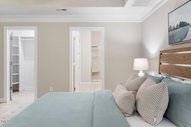 4724 Ludwell Branch Ct, Raleigh, NC 27612 - bedroom featuring a walk in closet, ornamental molding, connected bathroom, baseboards, and a closet