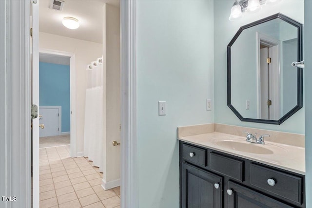 4724 Ludwell Branch Ct, Raleigh, NC 27612 - full bath featuring tile patterned floors, vanity, and baseboards