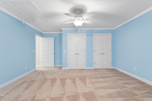 4724 Ludwell Branch Ct, Raleigh, NC 27612 - unfurnished bedroom featuring attic access, multiple closets, light colored carpet, baseboards, and ornamental molding