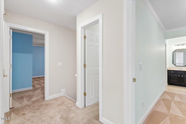 4724 Ludwell Branch Ct, Raleigh, NC 27612 - hallway featuring light carpet, ornamental molding, and baseboards