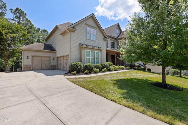 7632 Summer Pines Way, Wake Forest, NC 27587 - craftsman-style house with concrete driveway, a front yard, a garage, and stone siding
