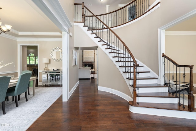 7632 Summer Pines Way, Wake Forest, NC 27587 - stairs with wood finished floors, ornamental molding, and a towering ceiling