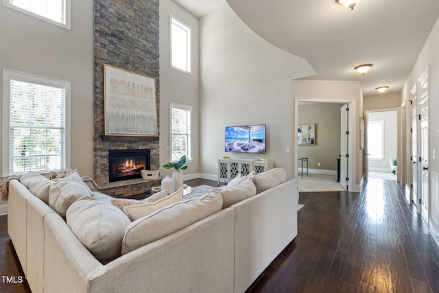7632 Summer Pines Way, Wake Forest, NC 27587 - living room featuring dark wood finished floors, a stone fireplace, and a high ceiling