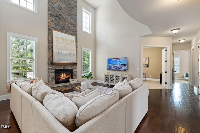 7632 Summer Pines Way, Wake Forest, NC 27587 - living room with dark wood finished floors, a stone fireplace, and a high ceiling