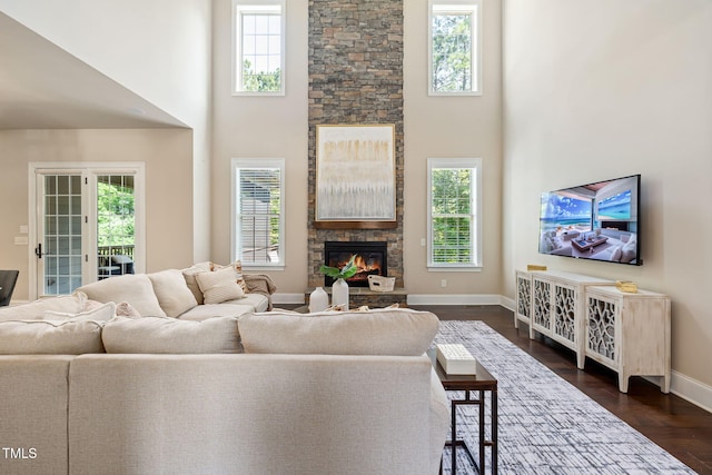 7632 Summer Pines Way, Wake Forest, NC 27587 - living room with a high ceiling, a fireplace, and dark wood finished floors