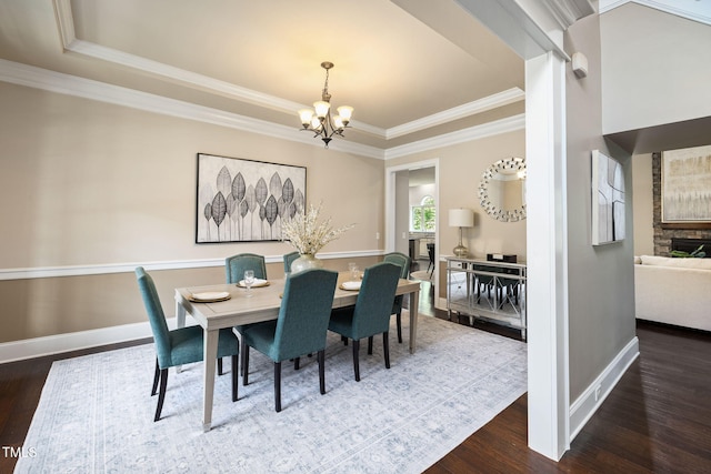 7632 Summer Pines Way, Wake Forest, NC 27587 - dining area featuring a chandelier, wood finished floors, a tray ceiling, and crown molding