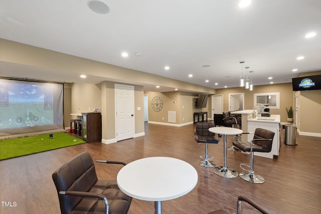 7632 Summer Pines Way, Wake Forest, NC 27587 - living area with dark wood finished floors, golf simulator, and recessed lighting