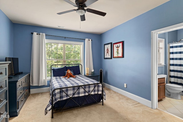 7632 Summer Pines Way, Wake Forest, NC 27587 - bedroom with light carpet, ensuite bath, and a ceiling fan