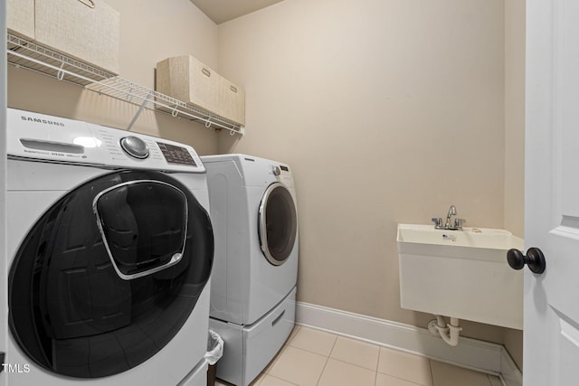 7632 Summer Pines Way, Wake Forest, NC 27587 - washroom with washing machine and dryer and light tile patterned flooring