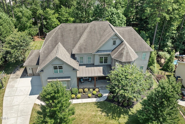 7632 Summer Pines Way, Wake Forest, NC 27587 - view of front facade with roof with shingles, a standing seam roof, a metal roof, and a front yard