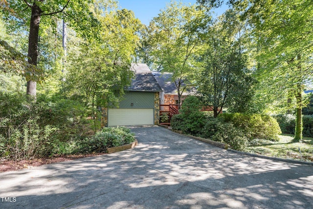 403 Rutherglen Dr, Cary, NC 27511 - view of front facade with a garage, concrete driveway, and stone siding