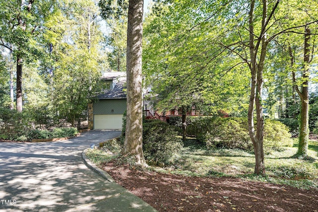 403 Rutherglen Dr, Cary, NC 27511 - obstructed view of property featuring asphalt driveway and an attached garage