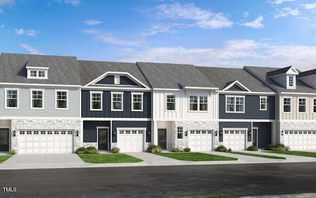 8763 Wardle Ct, Wake Forest, NC 27587 - townhome / multi-family property with a garage, stone siding, board and batten siding, and driveway