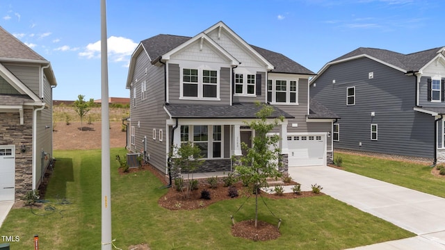 3500 Bailey Lake Dr, Fuquay Varina, NC 27526 - craftsman inspired home featuring driveway, roof with shingles, a front lawn, stone siding, and a garage