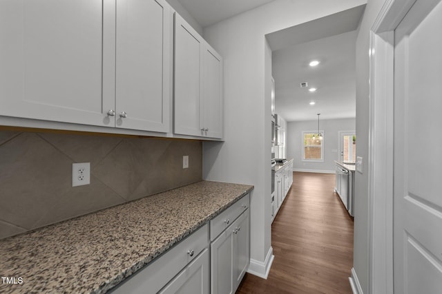 3500 Bailey Lake Dr, Fuquay Varina, NC 27526 - kitchen with dark wood finished floors, backsplash, light stone countertops, recessed lighting, and white cabinets