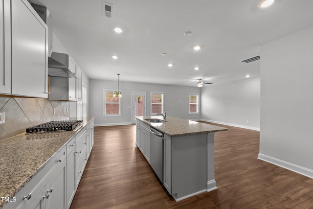 3500 Bailey Lake Dr, Fuquay Varina, NC 27526 - kitchen with appliances with stainless steel finishes, decorative backsplash, dark wood-type flooring, a ceiling fan, and recessed lighting