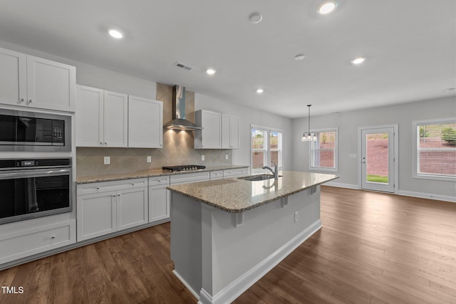 3500 Bailey Lake Dr, Fuquay Varina, NC 27526 - kitchen featuring stainless steel appliances, wall chimney range hood, dark wood-type flooring, white cabinets, and recessed lighting