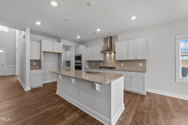 3500 Bailey Lake Dr, Fuquay Varina, NC 27526 - kitchen featuring wall chimney range hood, stainless steel appliances, decorative backsplash, white cabinets, and recessed lighting