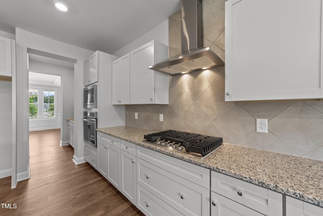 3500 Bailey Lake Dr, Fuquay Varina, NC 27526 - kitchen with wall chimney exhaust hood, stainless steel appliances, white cabinetry, dark wood-style floors, and tasteful backsplash