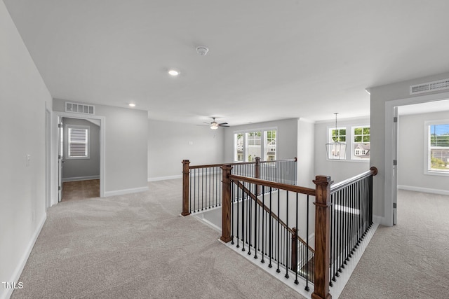 3500 Bailey Lake Dr, Fuquay Varina, NC 27526 - hallway with an upstairs landing, light colored carpet, and recessed lighting