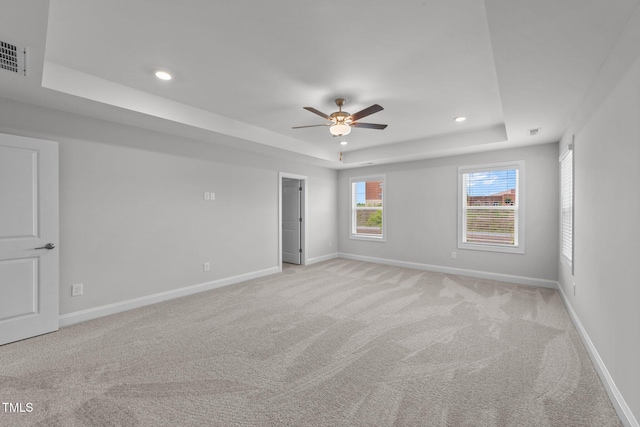 3500 Bailey Lake Dr, Fuquay Varina, NC 27526 - spare room with a raised ceiling, light carpet, a ceiling fan, and recessed lighting