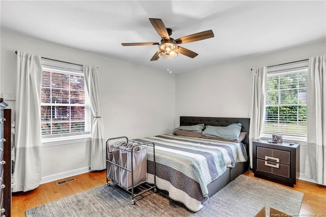 239 Rainier Dr, Fayetteville, NC 28314 - bedroom with wood finished floors, baseboards, and a ceiling fan