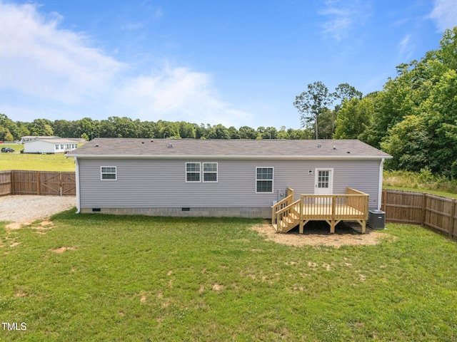 130 Ruby Trl, Roxboro, NC 27574 - back of property with a deck, crawl space, and a fenced backyard