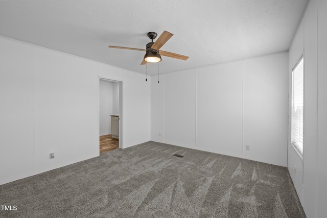 130 Ruby Trl, Roxboro, NC 27574 - carpeted empty room featuring ceiling fan