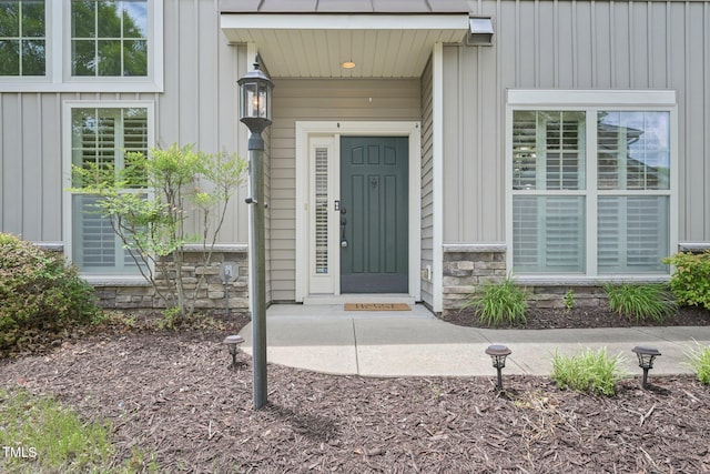 1090 Indigo Ridge Pl, Cary, NC 27519 - property entrance featuring board and batten siding and stone siding