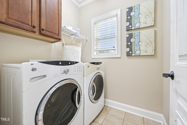 1090 Indigo Ridge Pl, Cary, NC 27519 - washroom with independent washer and dryer, light tile patterned floors, cabinet space, and crown molding