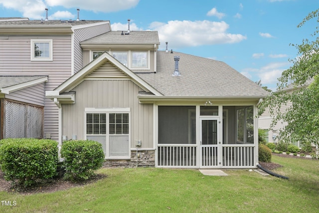 1090 Indigo Ridge Pl, Cary, NC 27519 - rear view of property with a sunroom, a yard, a shingled roof, and stone siding