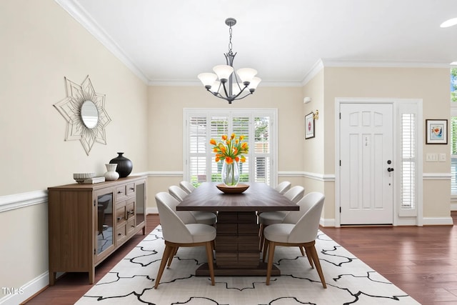 1090 Indigo Ridge Pl, Cary, NC 27519 - dining room featuring a chandelier, dark wood-style floors, and crown molding
