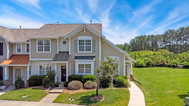 15 Canary Ct, Durham, NC 27713 - view of front of home featuring a front lawn, a standing seam roof, a shingled roof, and metal roof