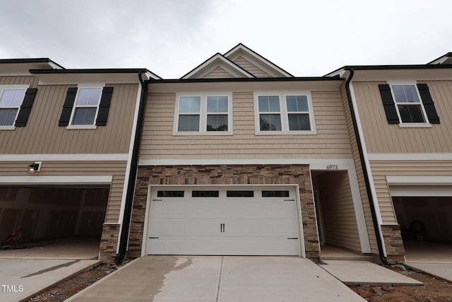 6973 Doddridge Ln Unit 17, Cary, NC 27519 - multi unit property featuring stone siding, a garage, and driveway