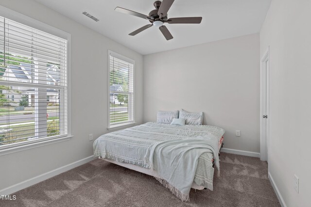 309 Highland Forest Dr, Fuquay Varina, NC 27526 - carpeted bedroom with baseboards and ceiling fan