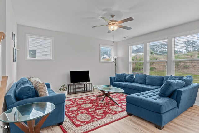 309 Highland Forest Dr, Fuquay Varina, NC 27526 - living area with a ceiling fan and wood finished floors