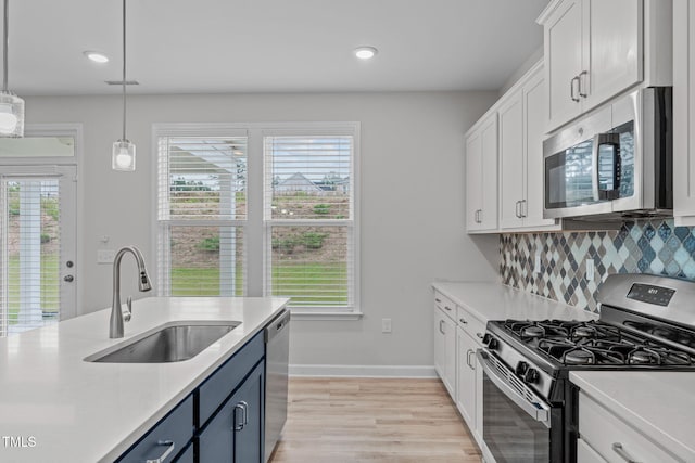 309 Highland Forest Dr, Fuquay Varina, NC 27526 - kitchen with appliances with stainless steel finishes, a sink, light countertops, and recessed lighting