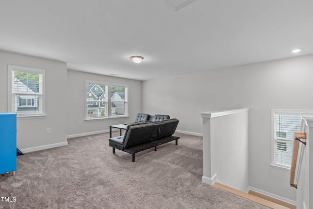 309 Highland Forest Dr, Fuquay Varina, NC 27526 - living area with an upstairs landing, plenty of natural light, and carpet flooring