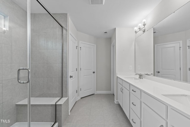 309 Highland Forest Dr, Fuquay Varina, NC 27526 - full bath featuring double vanity, a shower stall, tile patterned floors, and baseboards
