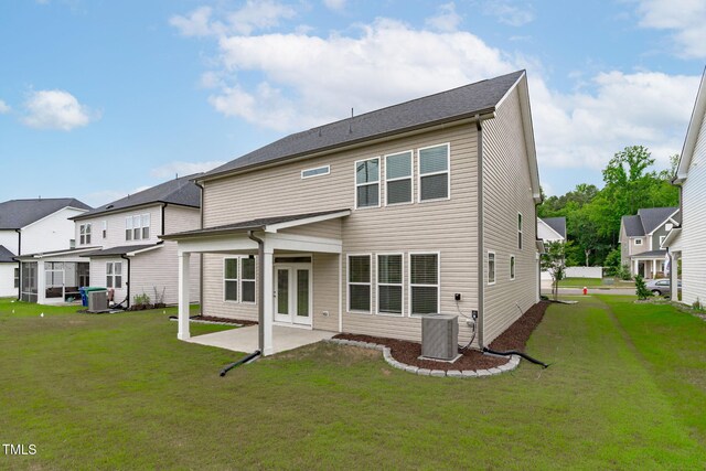 309 Highland Forest Dr, Fuquay Varina, NC 27526 - back of property featuring a lawn, a patio, central air condition unit, and a residential view