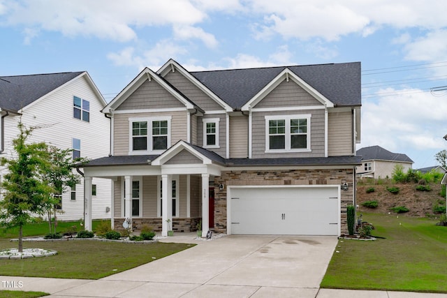 309 Highland Forest Dr, Fuquay Varina, NC 27526 - craftsman-style home with covered porch, concrete driveway, a front yard, an attached garage, and stone siding