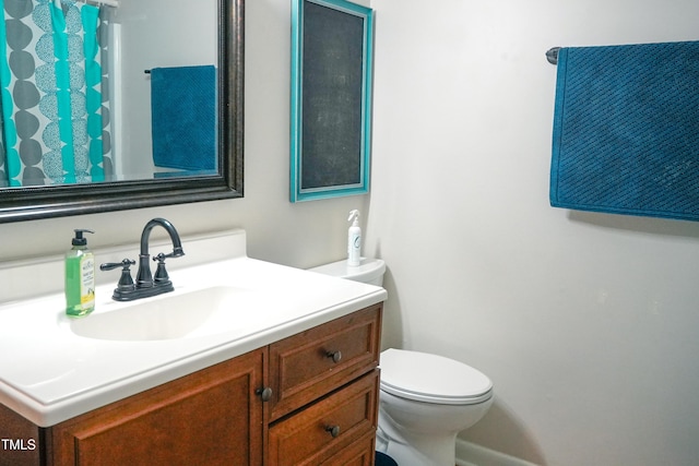 1423 Alderman Cir, Raleigh, NC 27603 - bathroom featuring vanity, toilet, and curtained shower