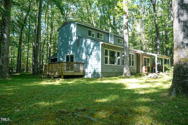 1423 Alderman Cir, Raleigh, NC 27603 - back of house with a lawn and a wooden deck